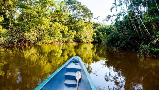 Canoe on river in Ecuador Amazon