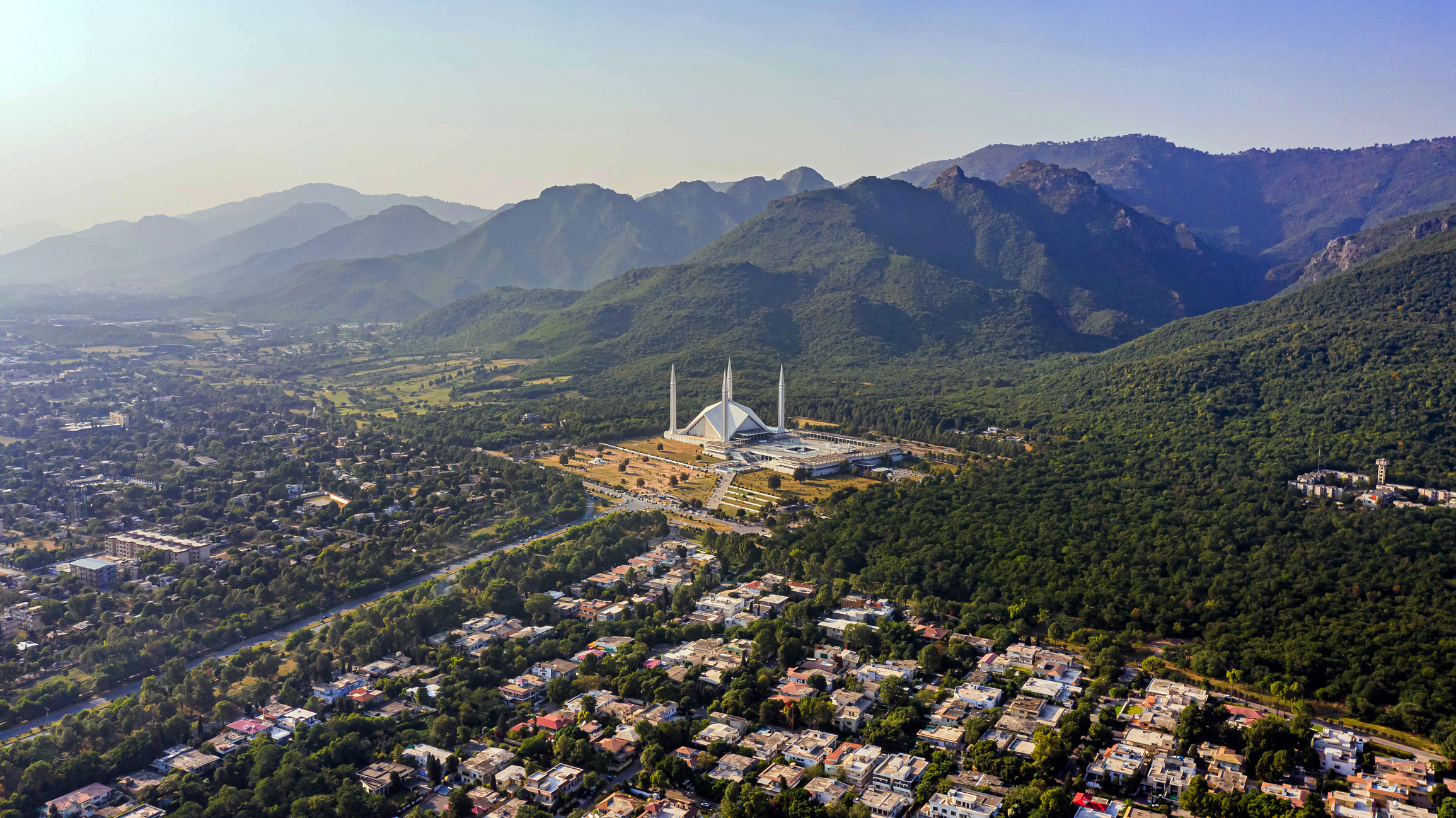 Shah Faisal mosque is the masjid in Islamabad, Pakistan. Located on the foothills of Margalla Hills. The largest mosque design of Islamic architecture, Mosque Drone Footage