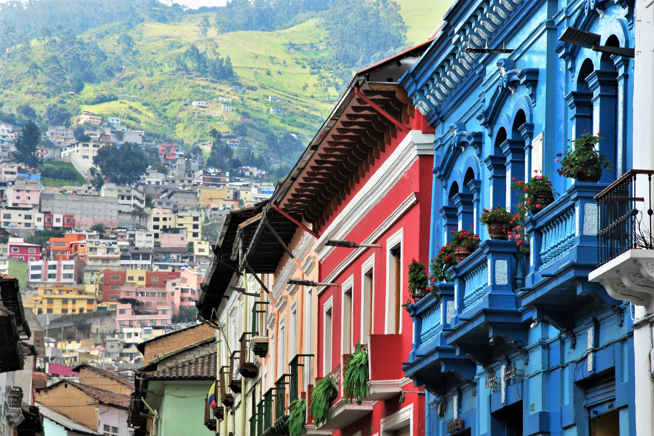 View of beautiful and colorful colonial architecture in Quito, Ecuador with mountains in the background