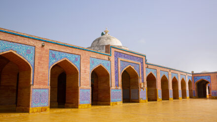 Shah Jahan Mosque in Thatta, Pakistan. Beautiful architecture, yellow, blue and orange colors.