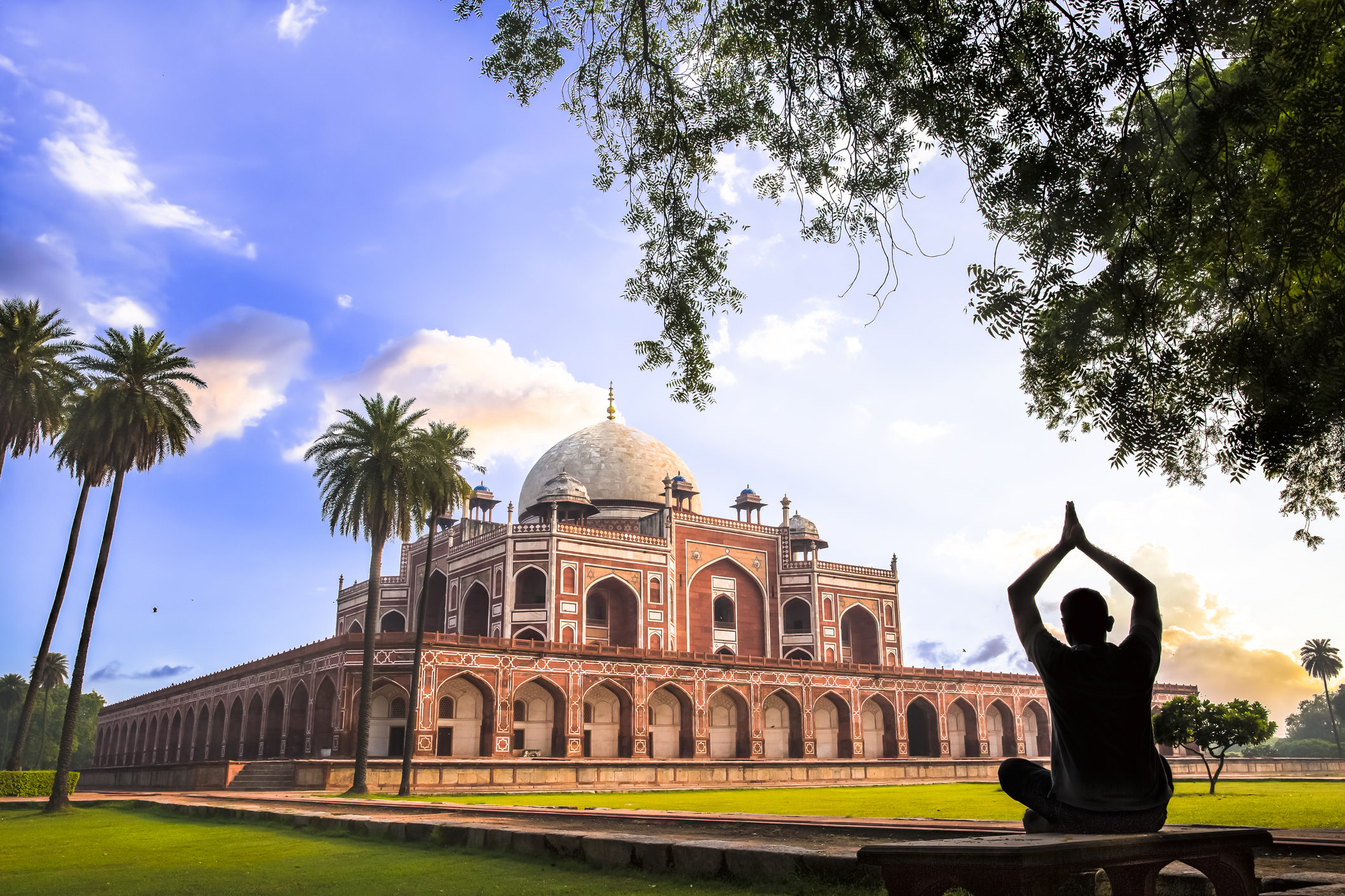 A man doing Yoga on the lawns of Humayun’s Tomb during the Early morning.