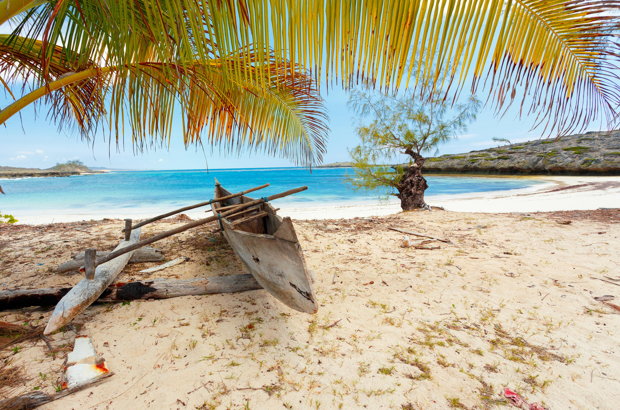 Traditional aboriginal Malagasy wooden hand made fisherman dugout catamaran boat - canoe on the in Diego Suarez bay, Madagascar