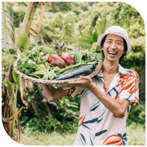 Man in Okinawa carrying a big vegetable basket.